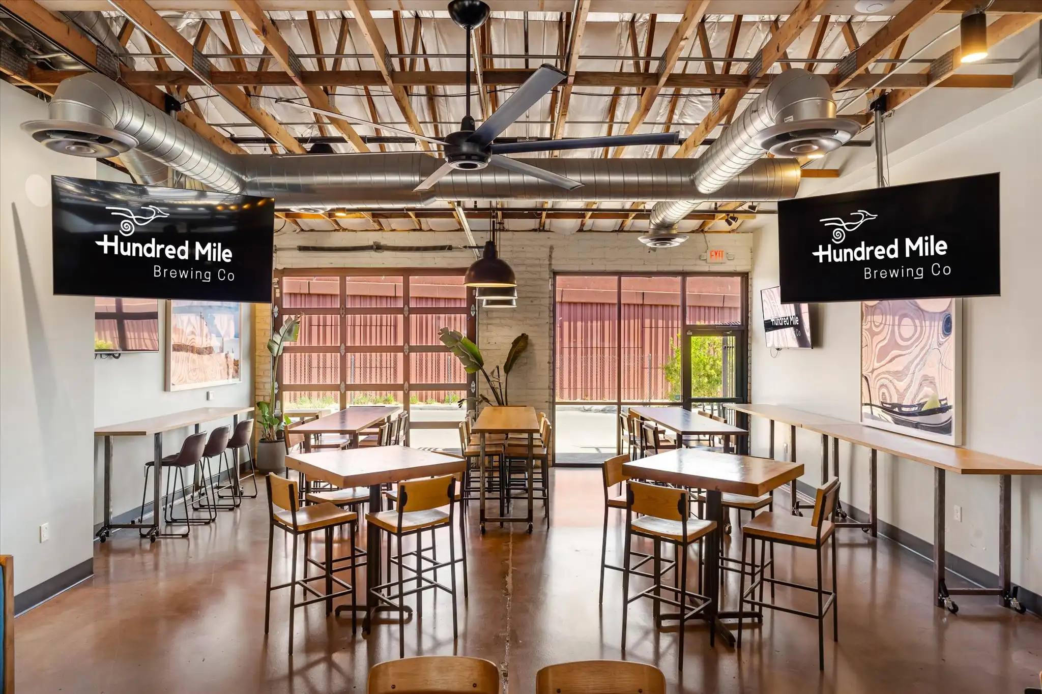 Coyote Cove, with long wood tables and bench seating in the semi-private room.