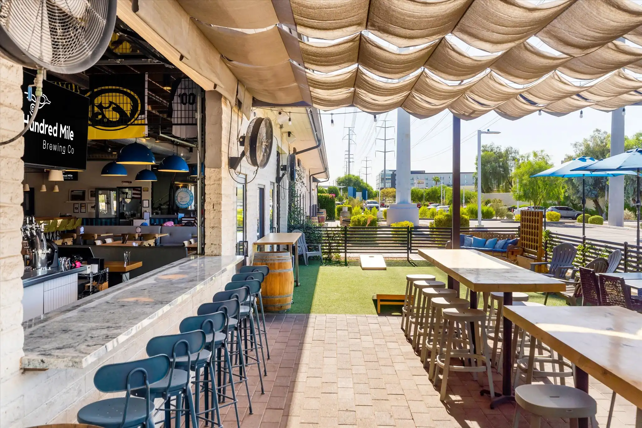 Patio facing a roll-up door that opens into the brewery.