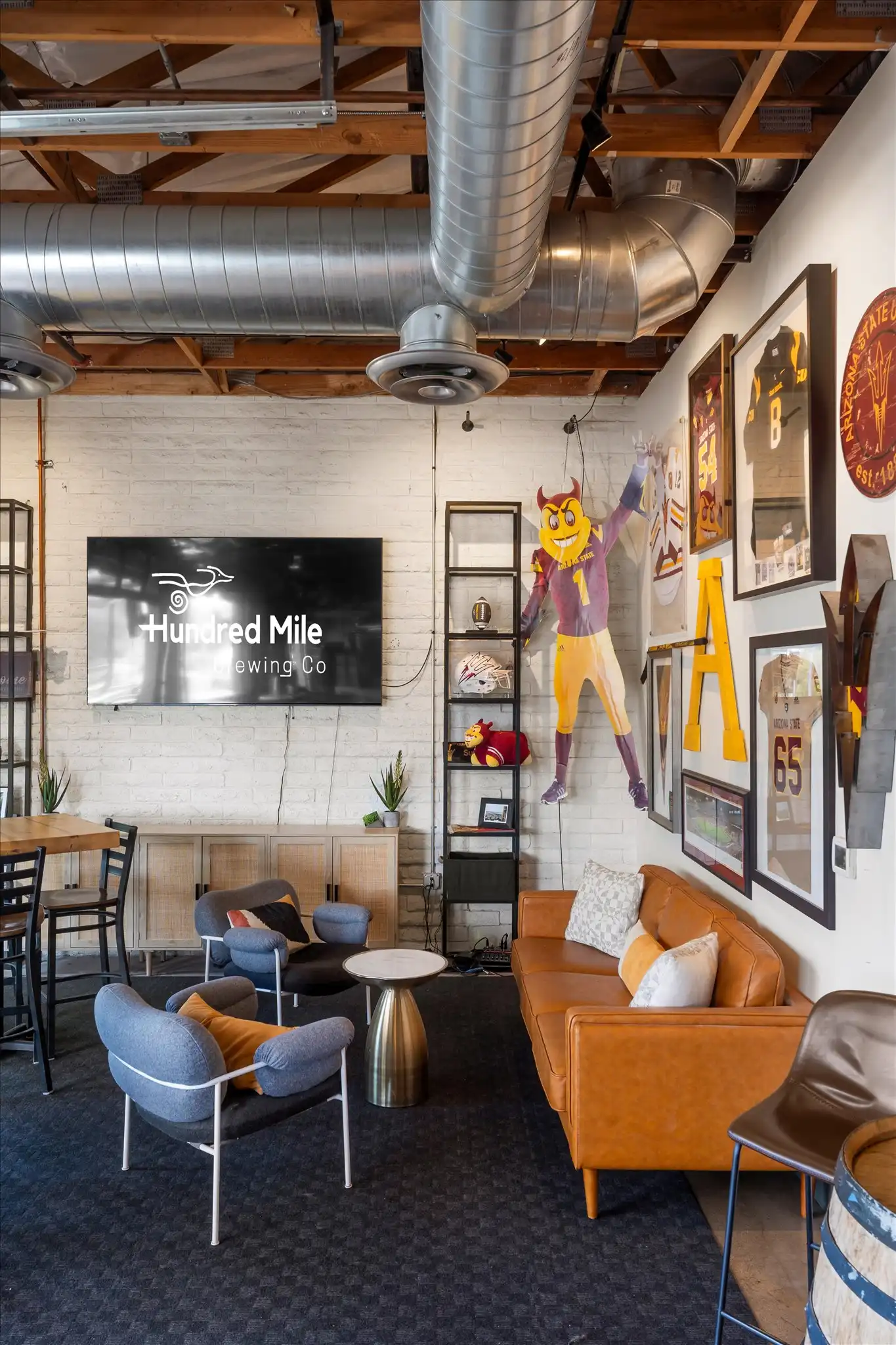 Sparky’s Corner, a narrow semi-private alcove with a wood ceiling and a large TV.