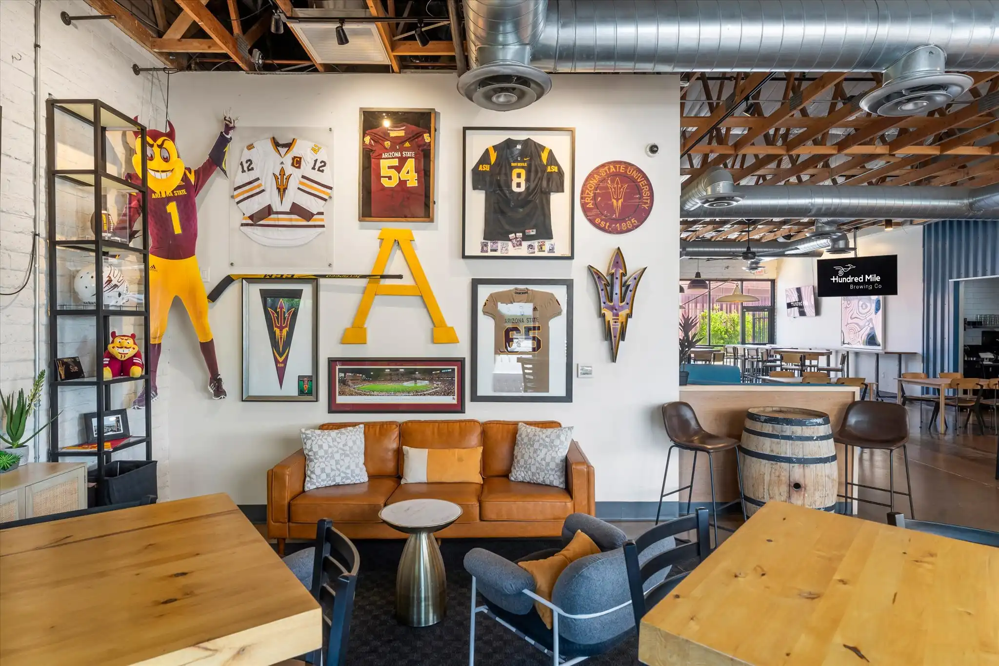 Sparky’s Corner, with seating and a television on the wall.